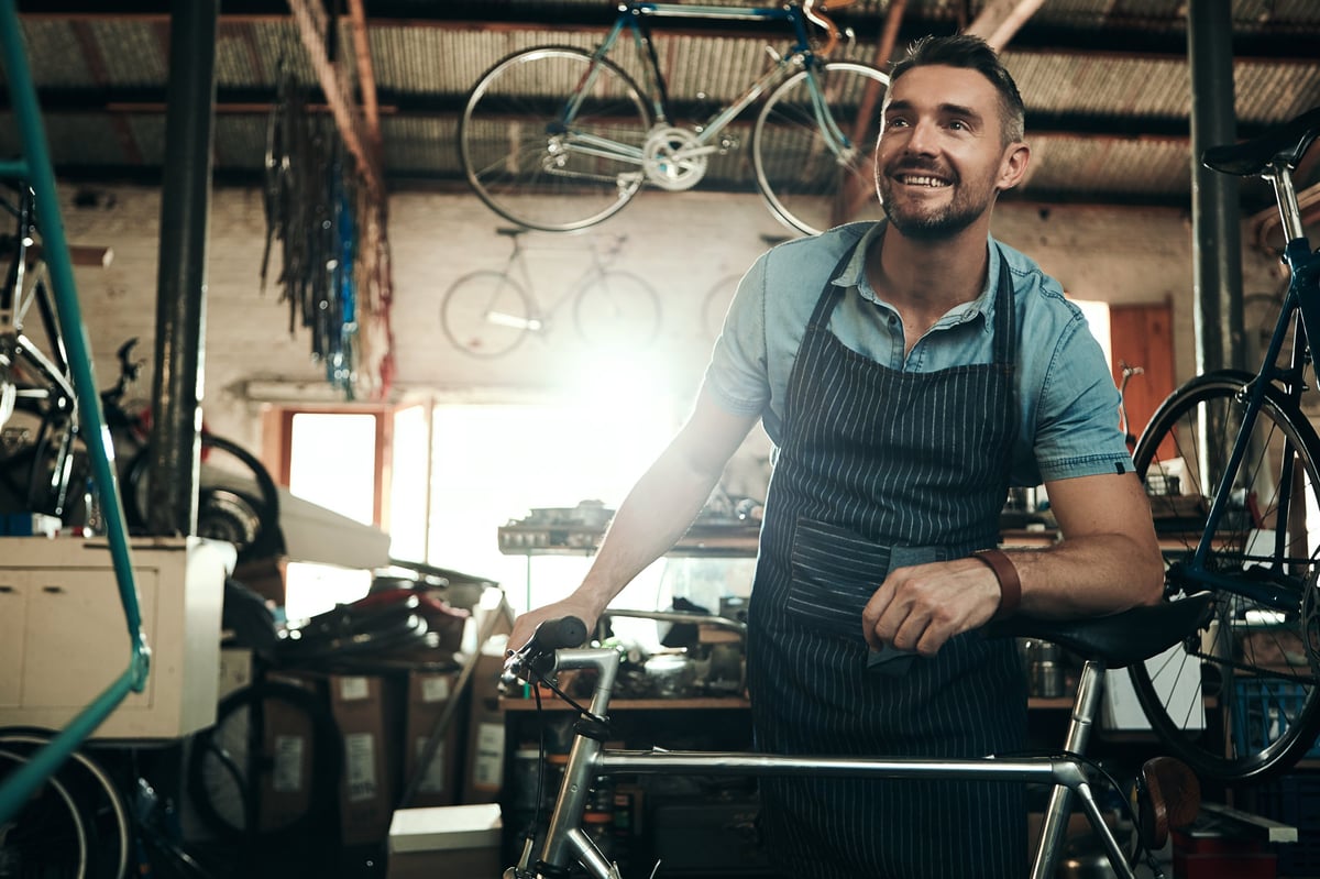 Shot of a mature man working in a bicycle repair shop